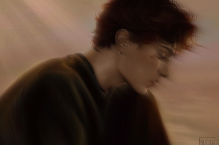 Blurred side profile of a boy in warm light